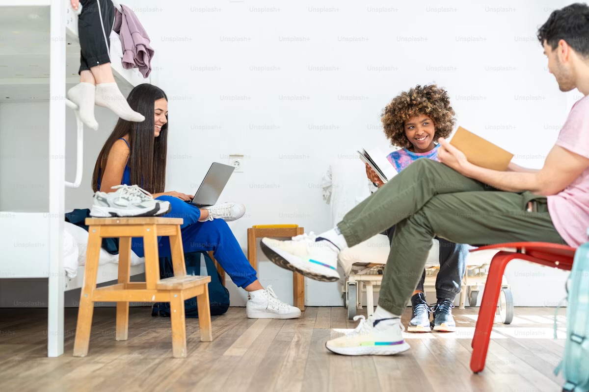 Students relaxing in a shared hostel room